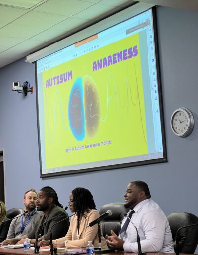 Healthcare Roundtable (Myron Mingo) Speaking with Autism Awareness Presentation on Projector