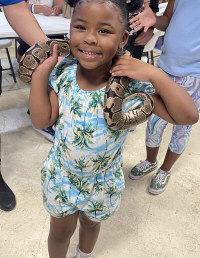 youth group program brave child holding snake